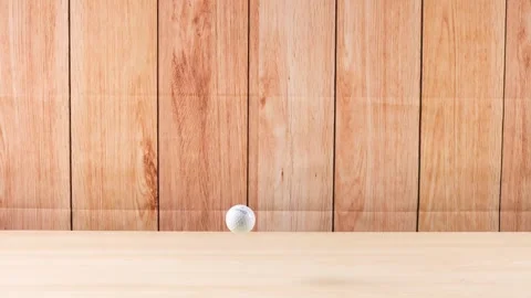 Golf Ball Rolling on Wooden Surface Vídeo Stock 313585957