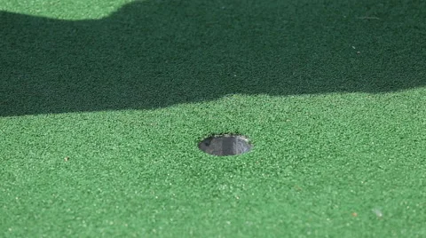 Golf Ball Sinking into the Hole Stock Footage 66275143