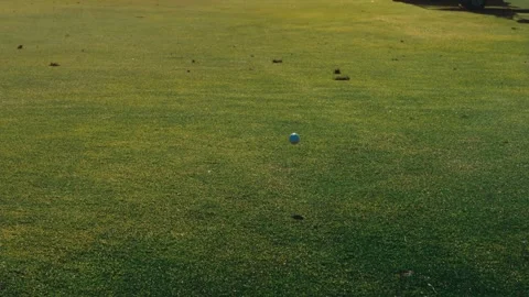Golf ball splashing in fairway Stock Footage 340117419
