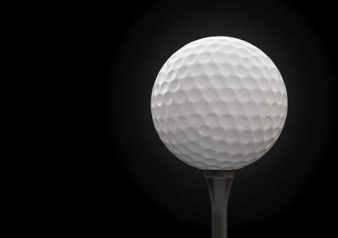 Golf ball on tee on black background Stock Illustration