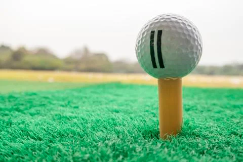 Golf ball on a Tee in driving range Stockfoto's