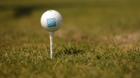 Golf ball teed up being hit Stock Footage 27799151