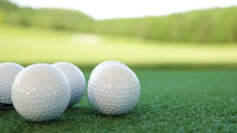 Golf balls on artificial grass Stock Footage 89501956