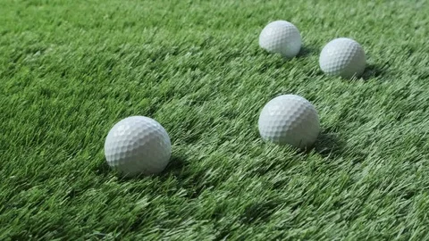 Golf balls on green grass Stock Footage 92817190