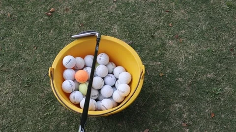 Golf balls inside a bucket Stock Footage 170806918