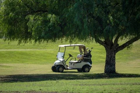 Golf car on the golf course Stock Photos