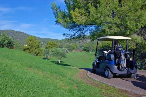 Golf cart on the course Stock Photos