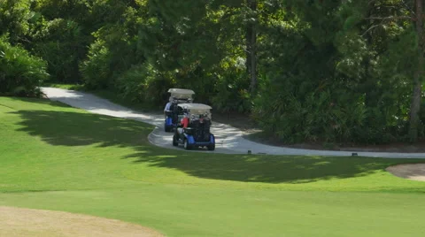 Golf Cart Driving on Course to Next Hole, 4K Stock Footage 55869571
