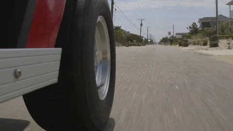 Golf Cart Driving Through Oceanfront Community Vídeo Stock 74470789