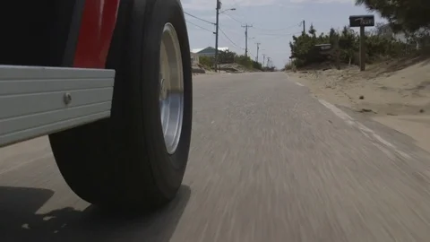 Golf Cart Driving Through Oceanfront Community Stock Footage 74480446