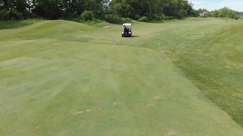 Golf cart on a fairway Stock Footage 129762458