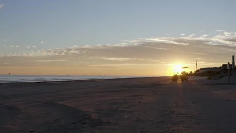 Golf cart in the sunset on beach Stock Footage 202176175