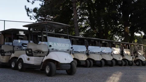Golf carts are lined up at a country club. Stock Footage 147984656