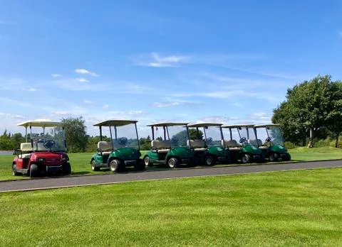 Golf carts at the golf course Stock Photos