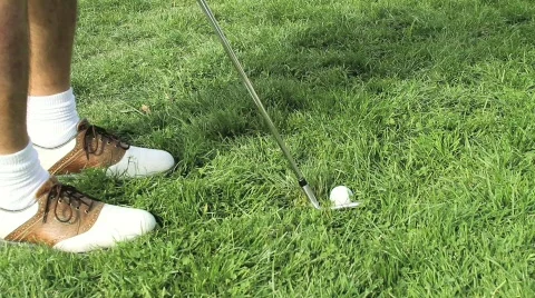 Golf chip shot out of rough grass Stock Footage 560656