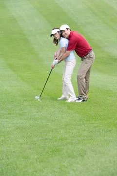 Golf coach teaching playing golf Stock Photos