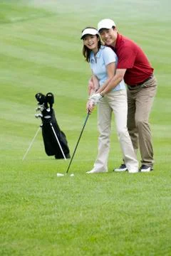 Golf coach teaching playing golf Stock Photos
