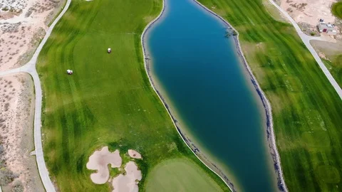 Golf Course Aerial Looking Down Along Pond Stock Footage 112896377