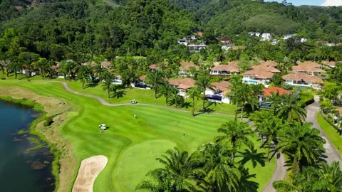 Golf course among palm trees. Drone video Video stock 272460402
