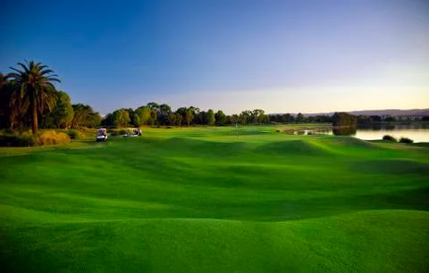 Golf course and buggies Stock Photos