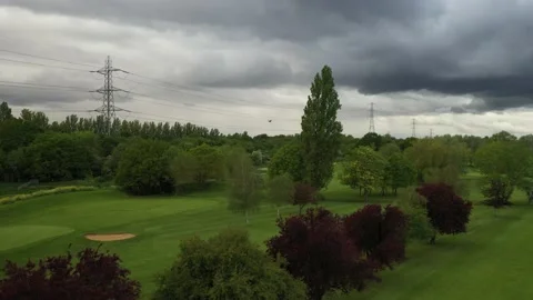 Golf course and surrounding park, high voltage power lines Video stock 155818121