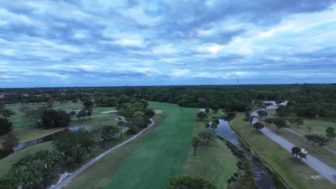 Golf course cinematic 4k drone green sky view Stock Footage 292740031