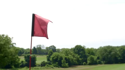 Golf Course, Close up of Flag, Pan Down To Shadow on Green Video stock 201098227
