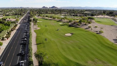 Golf Course Drone Shot Next to Highway Stock Footage 129769546