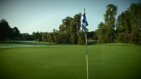 Golf Course Flag on Green With Motion Stock Footage