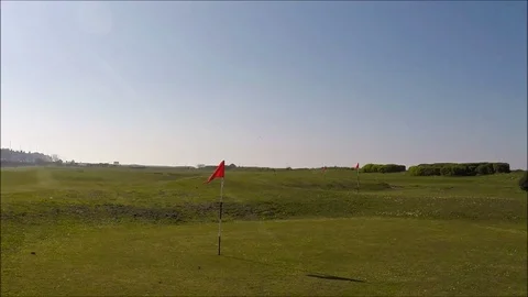 Golf course, flag in a hole Stock Footage 77863525