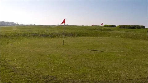 Golf course, flag in a hole Stock Footage 77863543