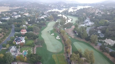 Golf Course Flyover with Lake Stock Footage 97898624