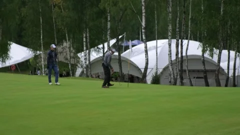 Golf course, golf competition, golfers playing golf Stock Footage 252095268