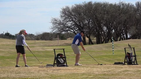 Golf course with golfers. Video stock 86993612