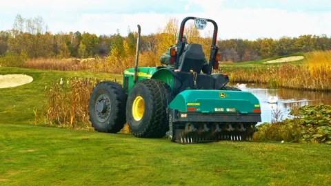 Golf course grass punching machine 1 Stock Footage 120773369