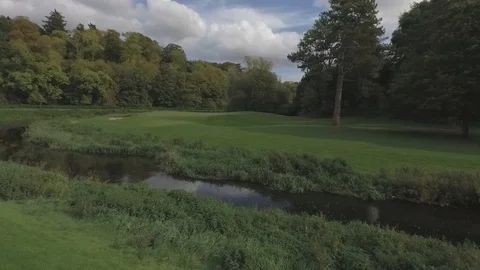 Golf Course Green and River Tripod Drone Shot Stock Footage 92835699