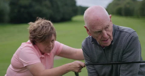 Golf course, instructor teaching man and club at field, nature or outdoor for Stock Footage 335914333