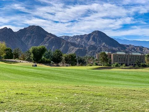Golf course with mountains in the background in Palm Springs California. Stock Photos