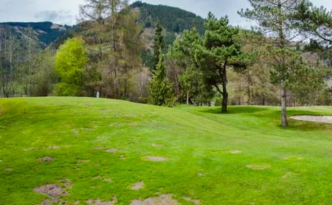 Golf course in mountains Stock Photos