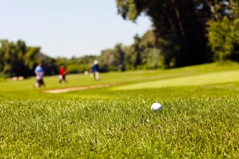 Golf course with players Stock Photos