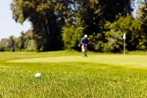 Golf course with players Stock Photos