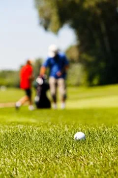 Golf course with players Stock Photos