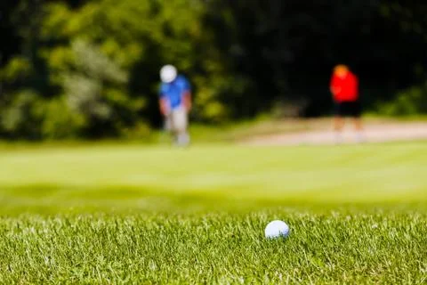 Golf course with players Stock Photos