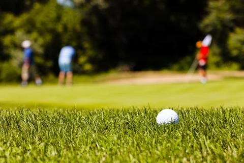 Golf course with players Stock Photos