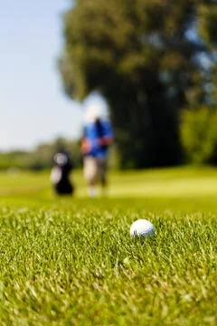 Golf course with players Stock Photos