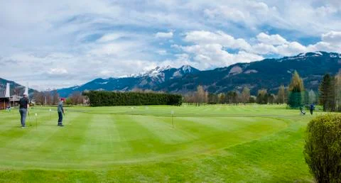 Golf course with players Stock Photos