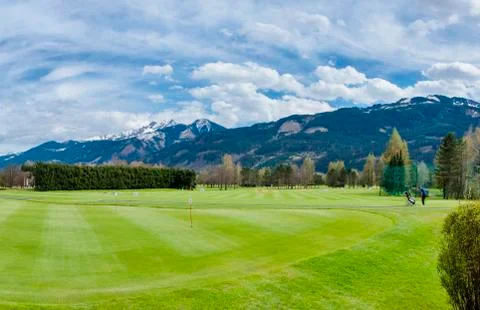 Golf course with players Stock Photos