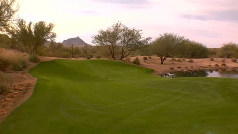 Golf course pond and desert sand with trees Stock Footage 125275960