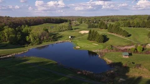 Golf course pond with putting green on the shore Видео 344106047
