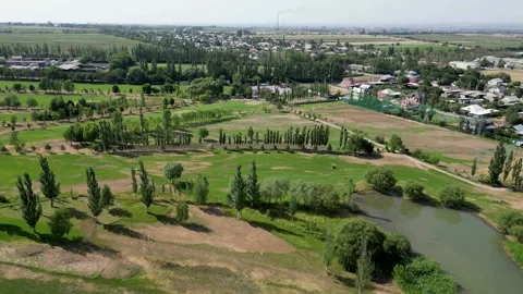 Golf course with pond at summer day, aerial 4k landscape footage Stock Footage 274299539